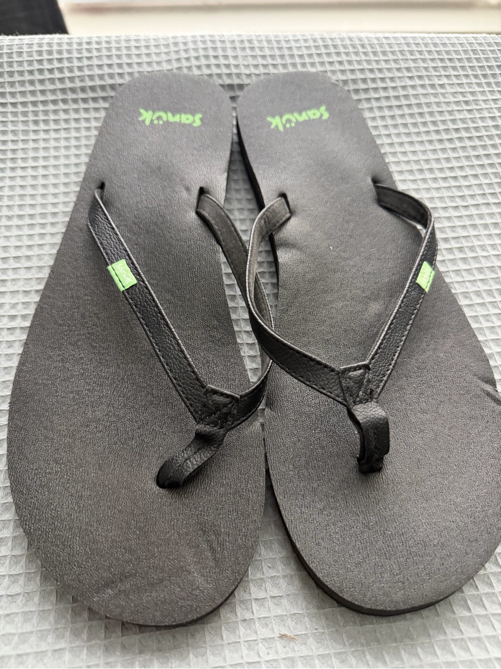 Sanuk Black Flip-Flops with Green Logo Tabs